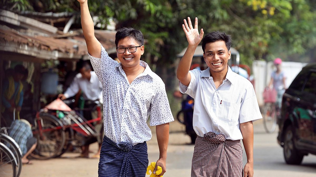 Image: Reuters reporters Wa Lone and Kyaw Soe Oo gesture as they walk free 