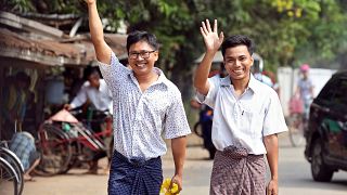 Image: Reuters reporters Wa Lone and Kyaw Soe Oo gesture as they walk free 