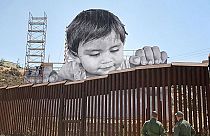 Art without borders: ‘French Banksy’ produces touching portrait of boy looking over US-Mexico border