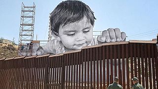 Art without borders: ‘French Banksy’ produces touching portrait of boy looking over US-Mexico border