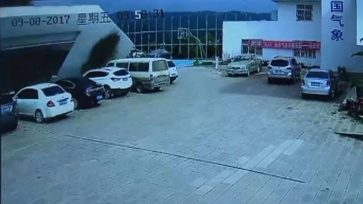 Watch: CCTV captures wall collapsing and flattening cars