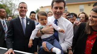 Image: U.S. Democratic presidential candidate Mayor Pete Buttigieg picks up