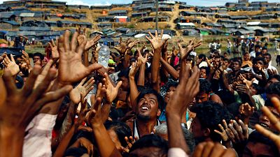 Hungry Rohingya refugees rush for handouts at Bangladesh camp
