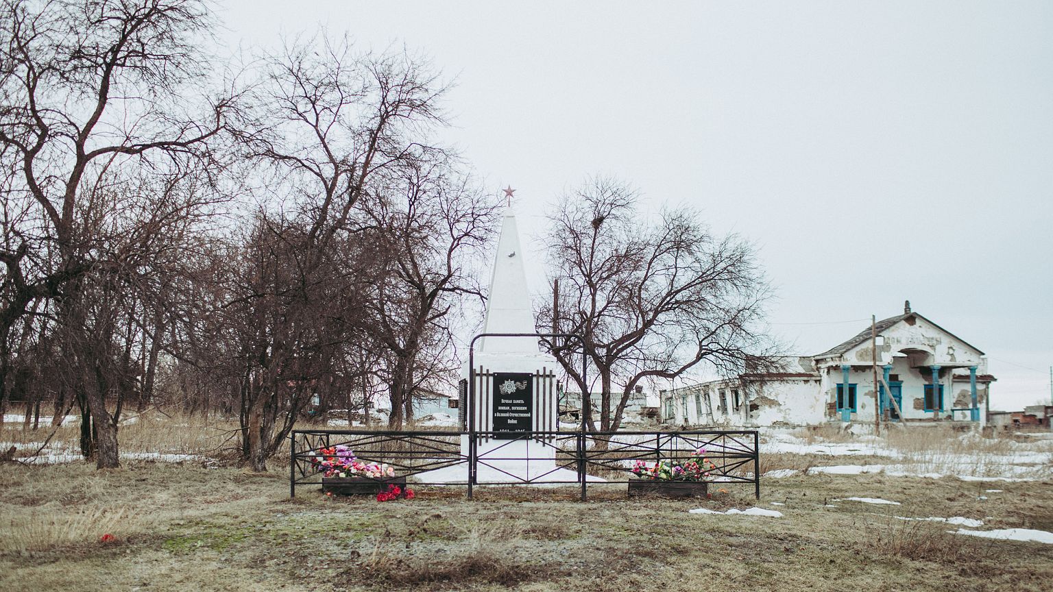Image: An abandoned Soviet-era House of Culture and a World War II monument