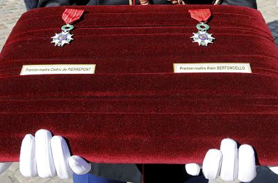 The medals awarded to slain French commandos Cedric de Pierrepont and Alain Bertoncello are presented during a ceremony in Paris on Tuesday.