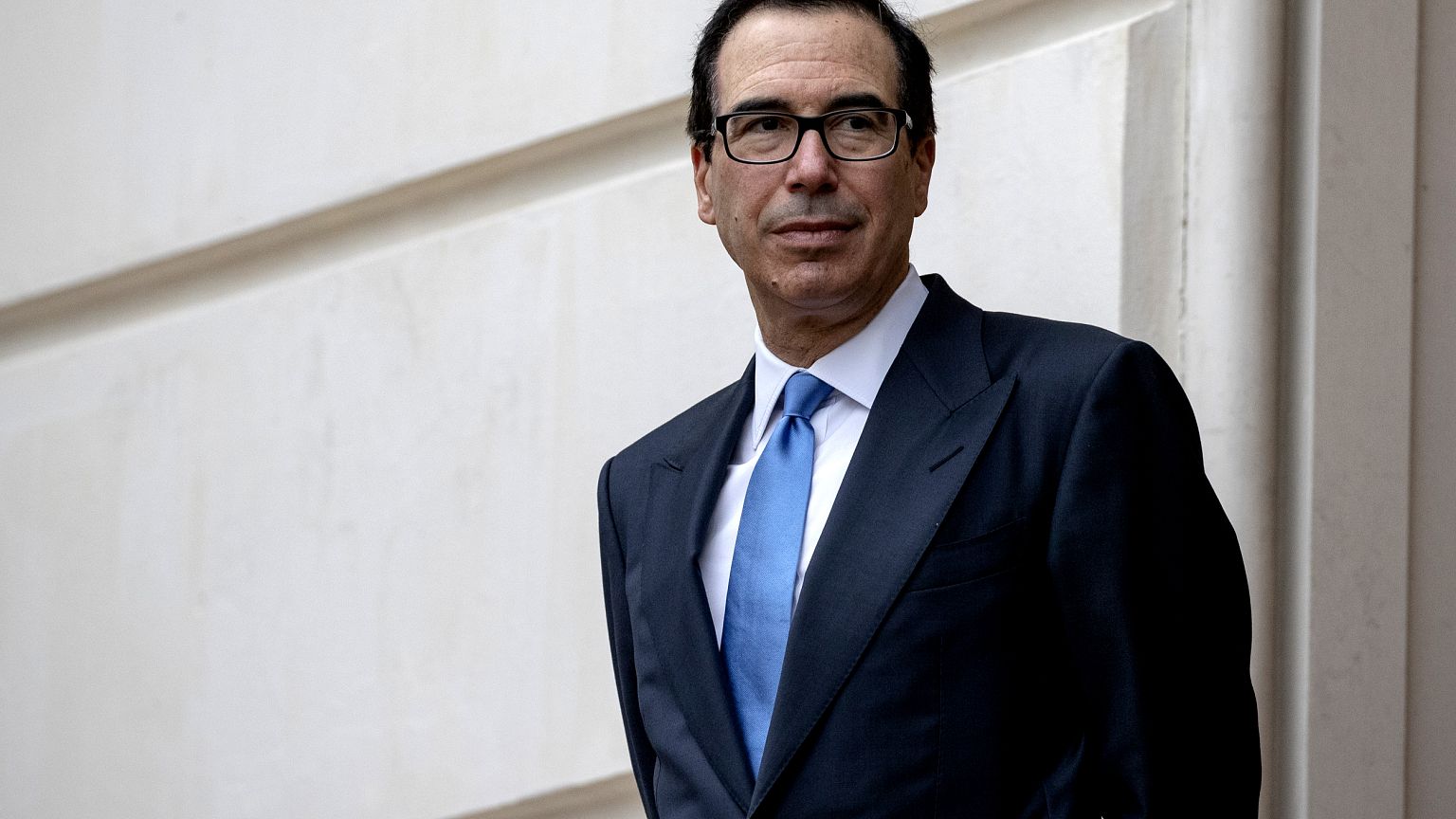 Image: Treasury Secretary Steve Mnuchin waits outside the Office of the U.S