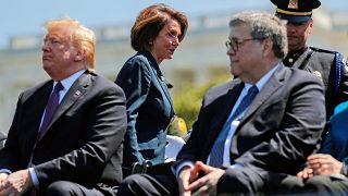 Image: Speaker of the House Pelosi walks behind President Trump and Attorne