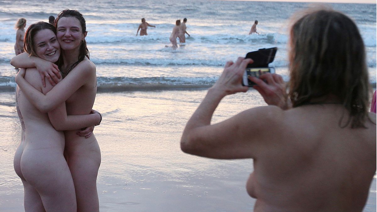 Around 400 nude swimmers brave the freezing North Sea for annual UK skinny dip