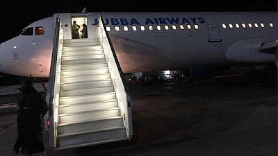 Somalis cheer first night landing of plane at Mogadishu airport in 27 years