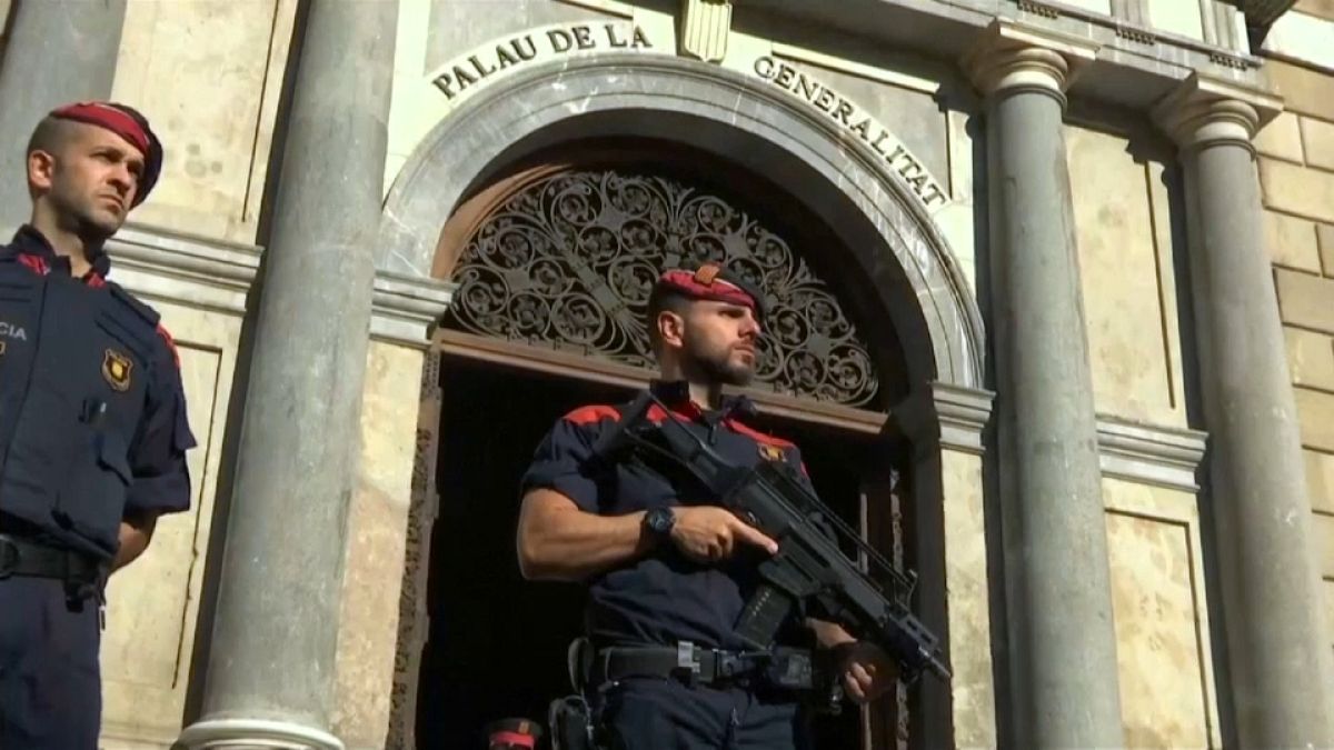 Catalan police seal off polling booths to block independence vote