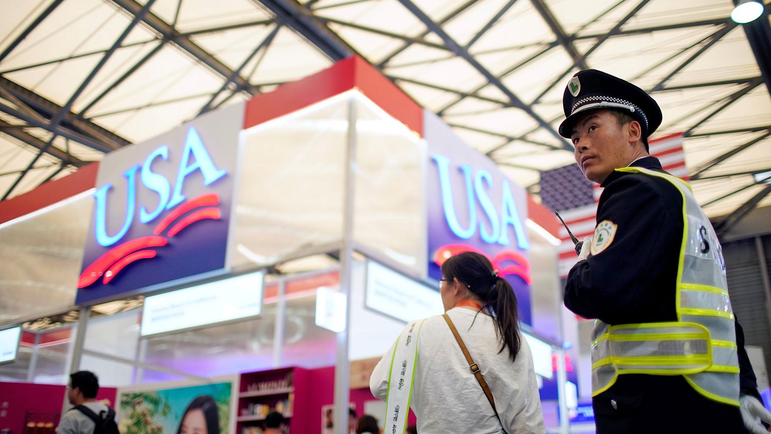 Image: A security officer keeps watch at U.S. food booths at SIAL food inno