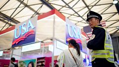 Image: A security officer keeps watch at U.S. food booths at SIAL food inno