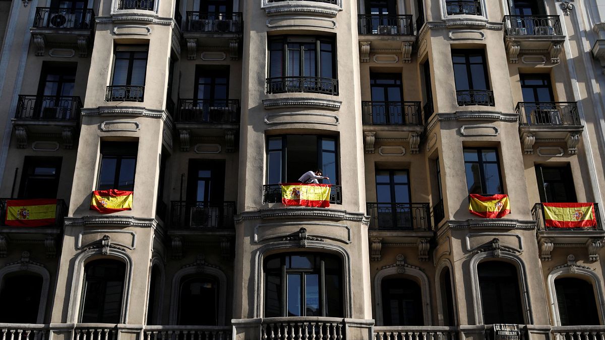 In Madrid the talk is of unity and the buildings draped with flags