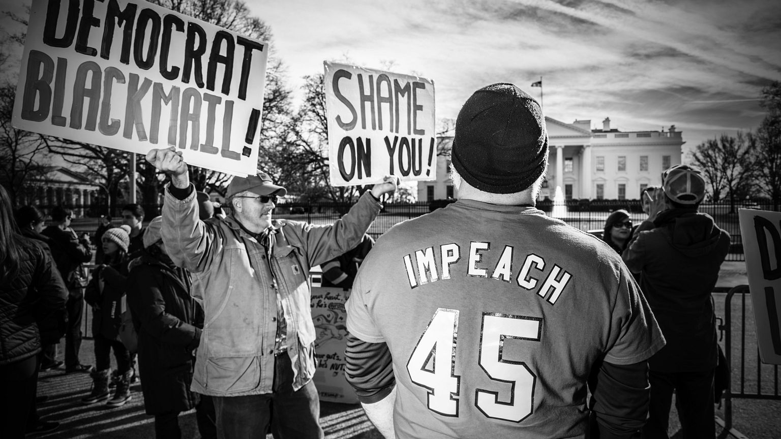 Image: Protesters pass the White House during the Women's March in Washingt