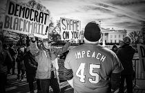 Image: Protesters pass the White House during the Women's March in Washingt
