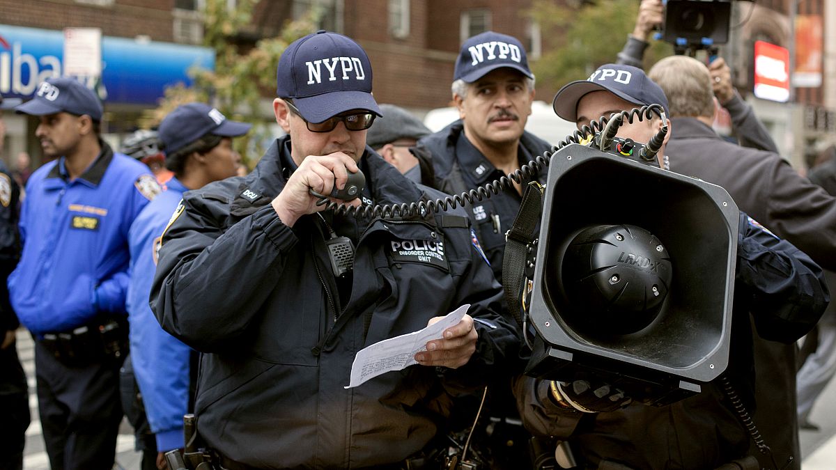 Image: NYPD Officers use the LRAD to give announcements to a crowd in Washi