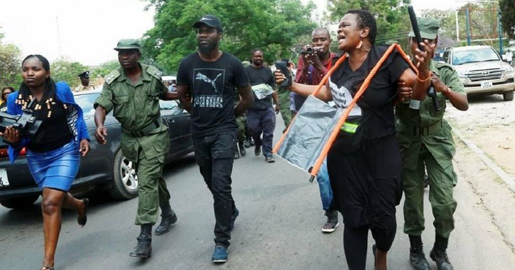 Police and anti-corruption protesters clash outside Zambian parliament ...