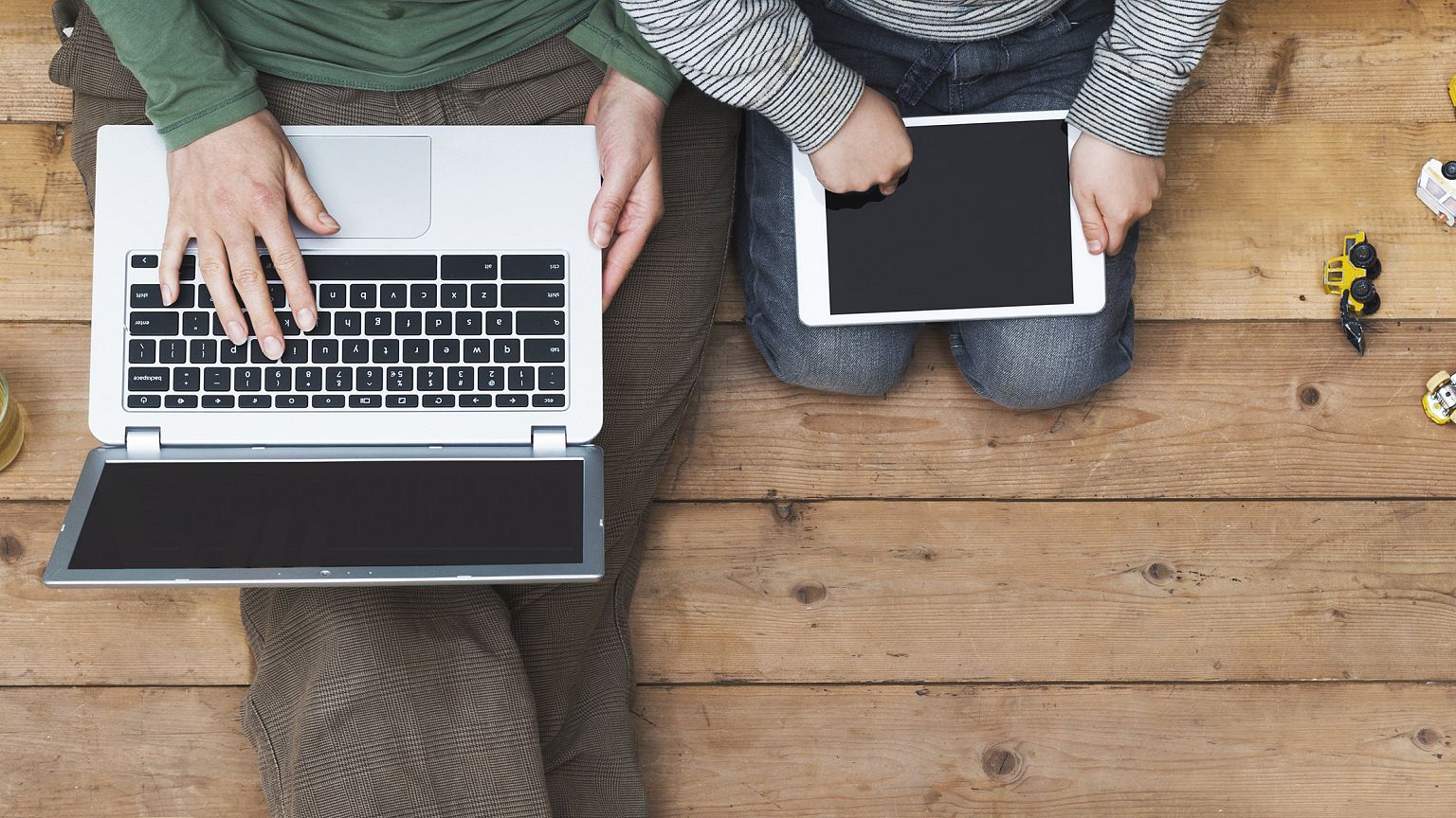 Image: mother and son using laptop and tablet pc