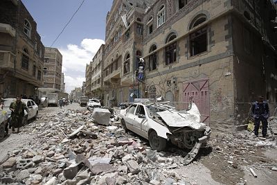 People inspect the site of an airstrike by Saudi-led coalition in Sanaa, Yemen on May, 16, 2019.