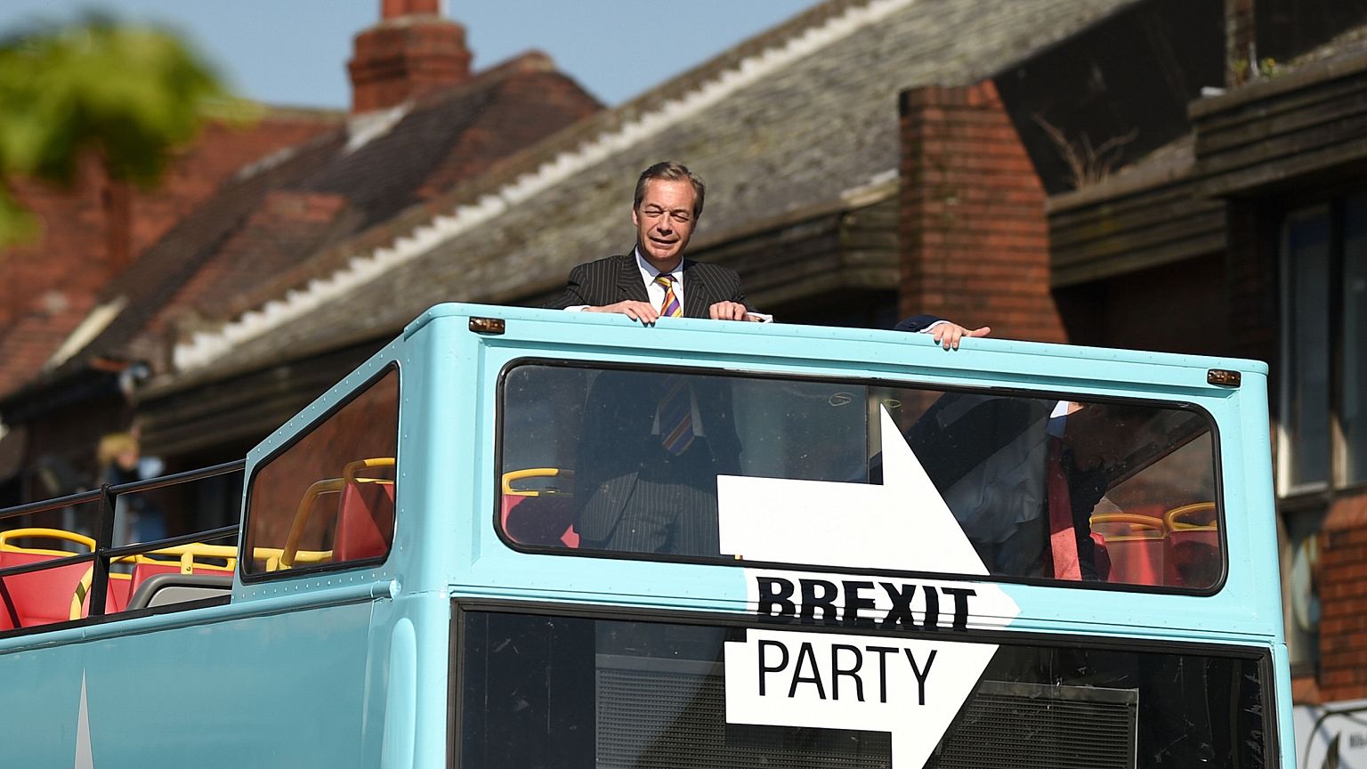 Image: Brexit Party leader Nigel Farage rides on their bus during a visit c