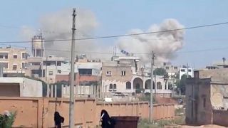 Image: Plumes of smoke rising from a town, said to be Saraqib, Idlib provin