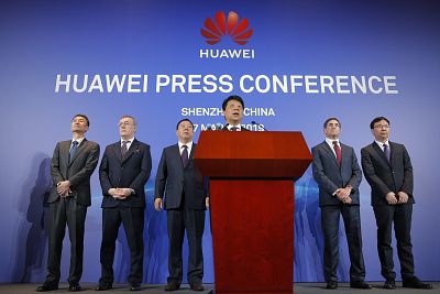 Huawei Rotating Chairman Guo Ping, center, speaks in front of other executives during a press conference in Shenzhen, China, on March 7, 2019.