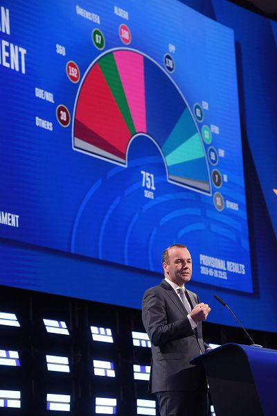 Manfred Weber stands near a projection of European Parliament election results during an event in Brussels on Sunday.