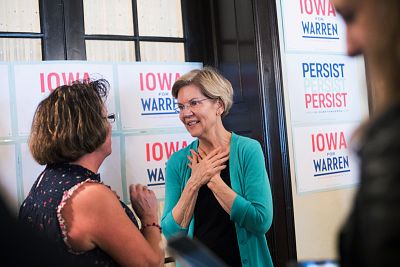 Elizabeth Warren speaks with a voter in Ottumwa, Iowa, on May 26, 2019.