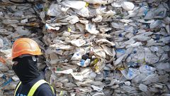Image: A container is filled with plastic waste from Australia, in Port Kla