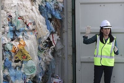 Environment Minister Yeo Bee Yin shows a plastic waste shipment in Port Klang, Malaysia, on Tuesday.