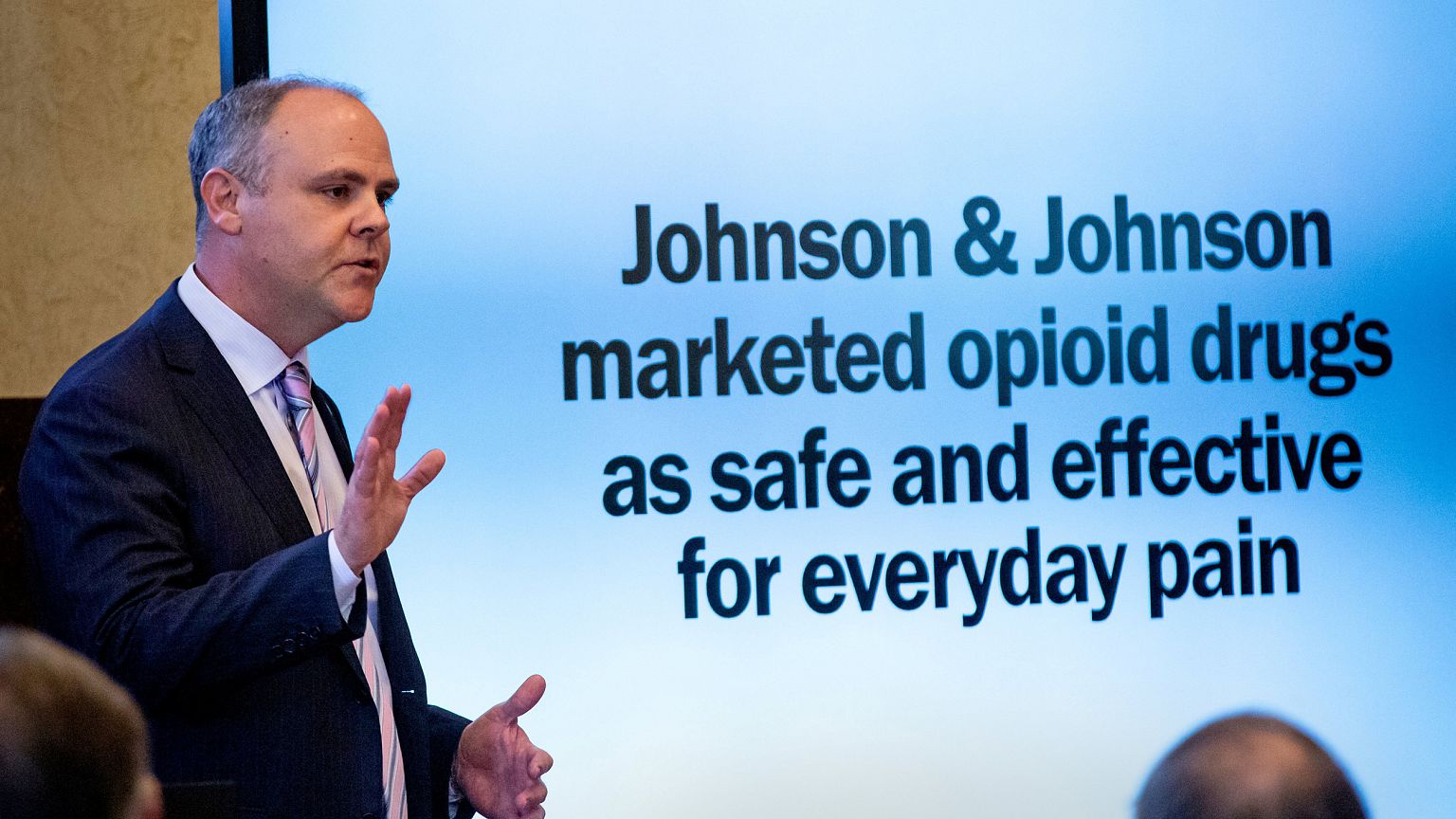 Image: State's attorney Brad Beckworth presents information in the opening 