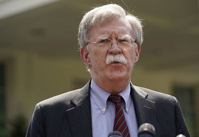 White House national security adviser John Bolton takes questions a outside the White House on April 30, 2019.