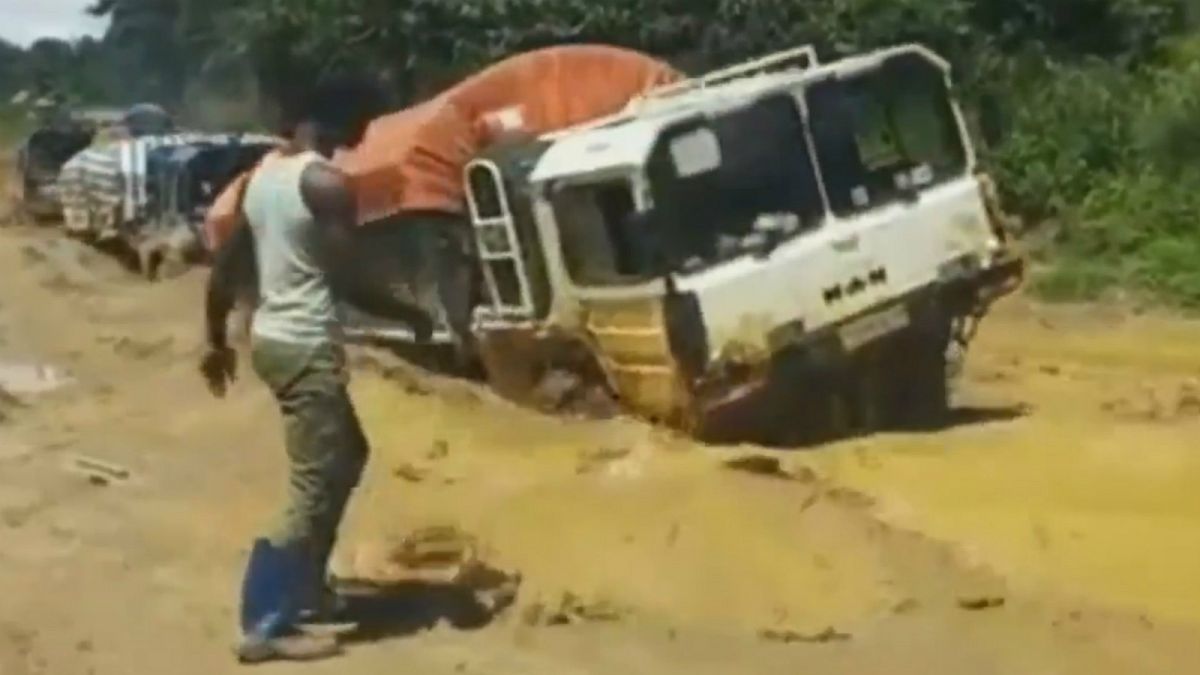 Watch: Aid trucks swarm across pools of mud