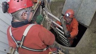 Image: Spelunker Philippe Poisson, left, and Laurent Dujardin exit a quarry