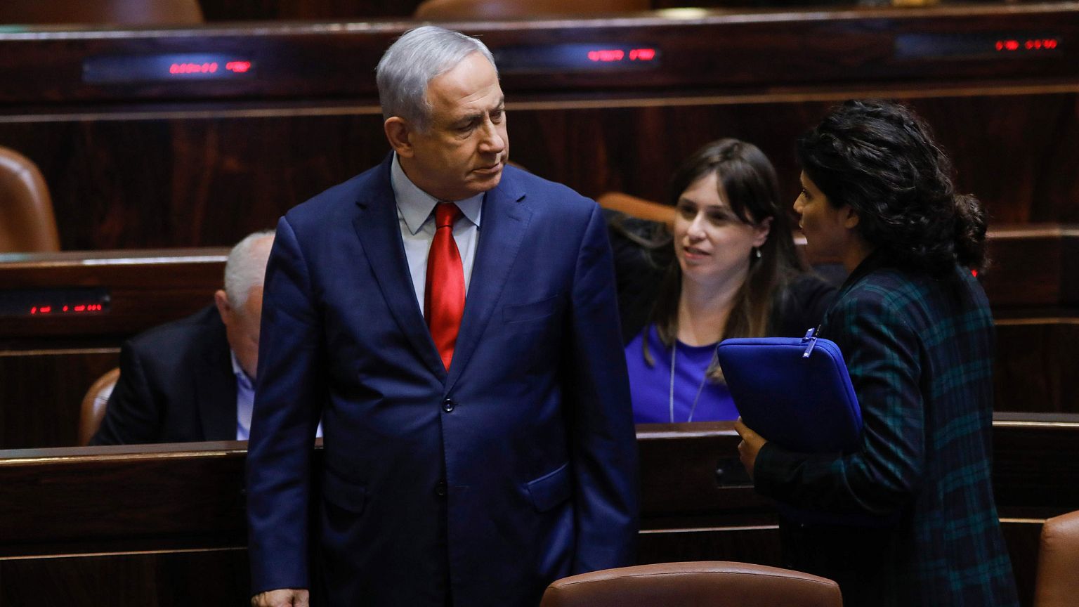 Image: Israeli Prime Minister Benjamin Netanyahu stands during a vote on a 
