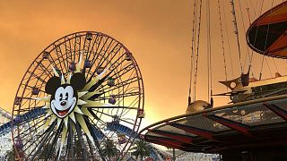Orange ashy sky brings spooky feeling to Disneyland resort in California
