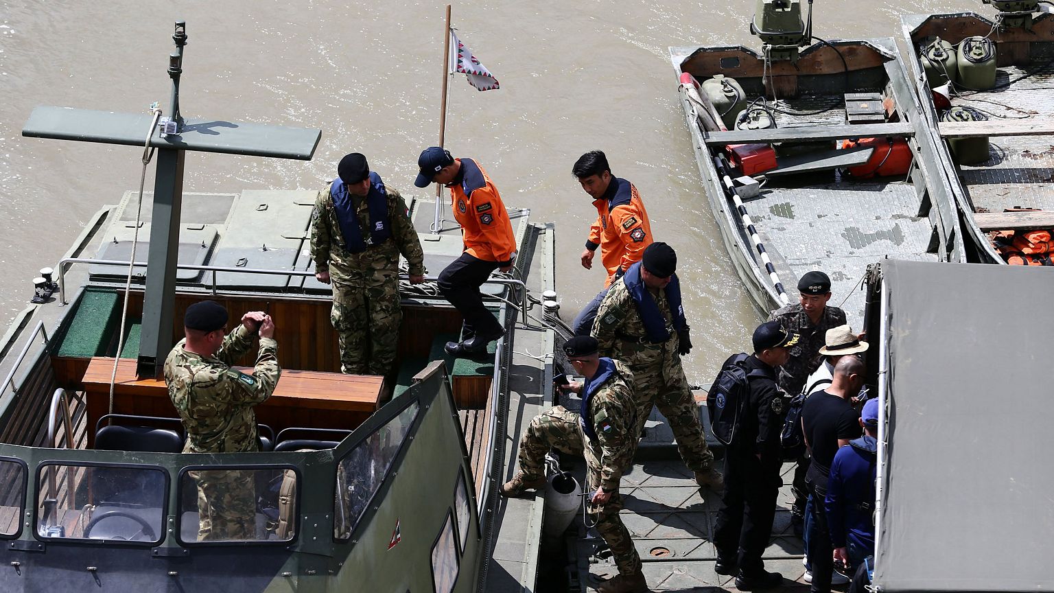 Image: A South Korean rescue team at the site of a ship accident, which kil