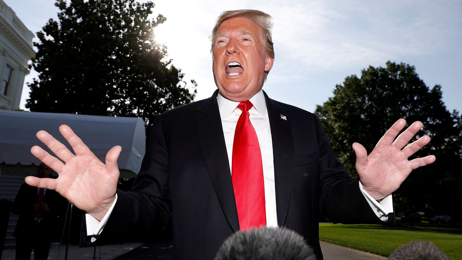 Image: President Trump speaks to reporters as he departs for travel to Colo