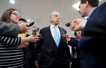 Image: U.S. Senator Grassley speaks to reporters on his way from the Senate