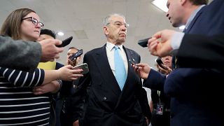 Image: U.S. Senator Grassley speaks to reporters on his way from the Senate