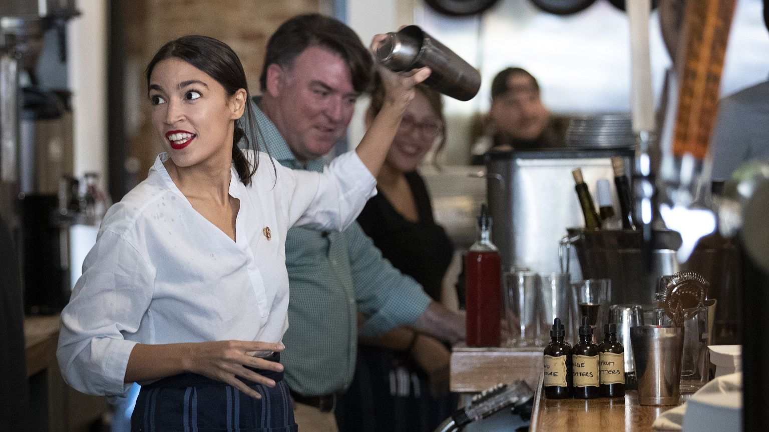 Image: Rep. Alexandria Ocasio-Cortez Bartends In Support Of Raise the Wage 