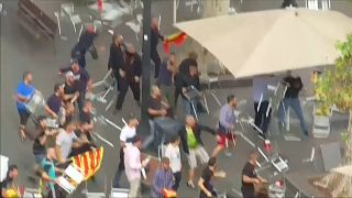 Chairs fly in Barcelona on sidelines of pro-unity demonstration