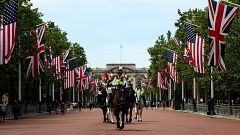 Image: Police officers ride horses on The Mall near Buckingham Palace befor