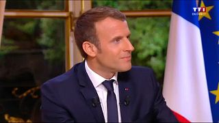 Macron gives first live TV interview