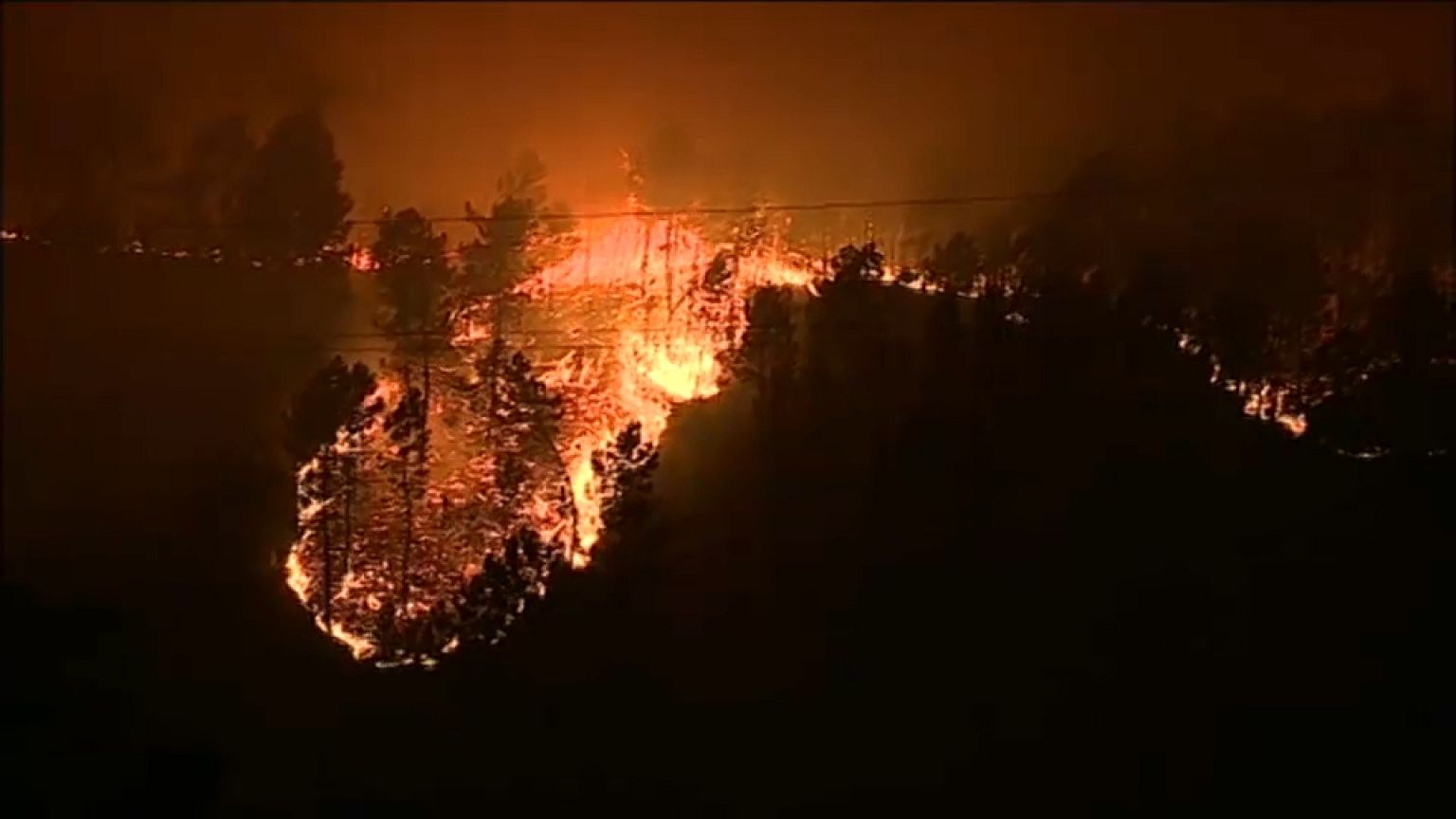 'Over 30 dead' as wildfires rage in Portugal and Spain