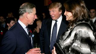 Image: Prince Charles chats with Donald Trump and his wife Melania Trump du