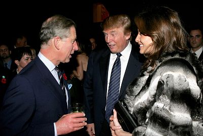 Prince Charles chats with Donald Trump and his wife Melania Trump during the Museum of Modern Art reception on the first day of the royal eight-day visit to the U.S., on Nov. 1, 2005 in New York City.