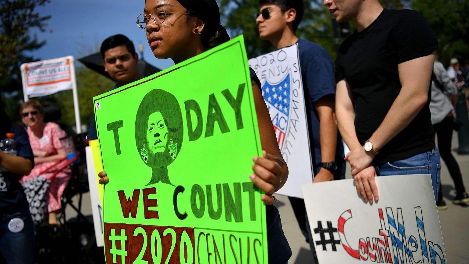 Image: Demonstrators rally at the Supreme Court as arguments are heard on a