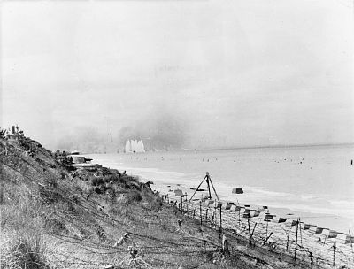 German coastal batteries firing at Allied forces landing in Normandy in Arromanches-les-Bains. France.