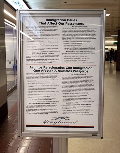 A sign in the New York Port Authority Bus Terminal informs Greyhound passengers about their rights during a Border Patrol bus check in English and Spanish.